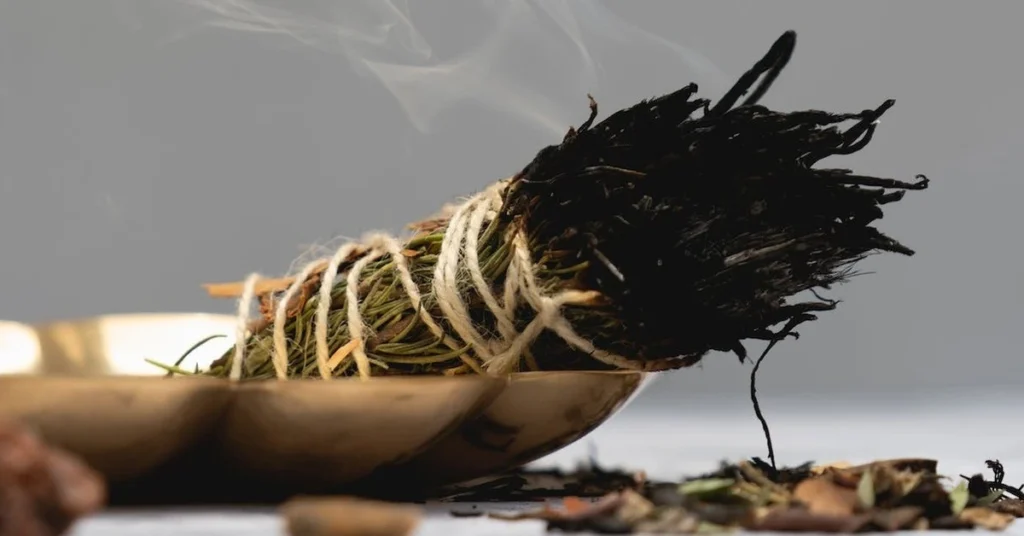 herbs tied together burning like incense